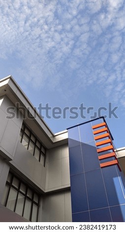 A building with blue sky view and a little bit of cloud 