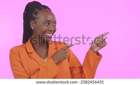 Black woman, pointing and advertising presentation with information or news, smile with presenter on pink background. Mockup, launch announcement with marketing ads and coming soon in a studio