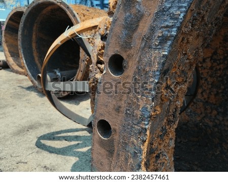 close up - a large damaged and rusty pipeline in an industry