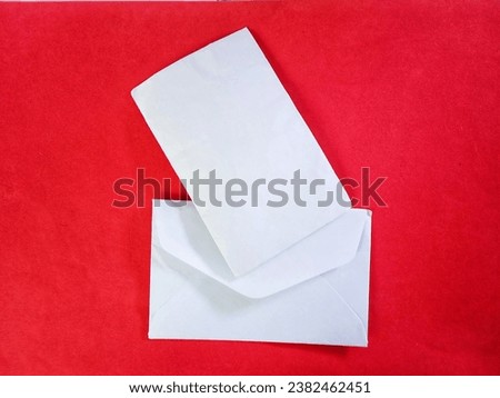 small white envelope with red background
