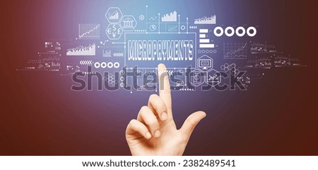 Micropayments theme with hand pressing a button on a technology screen Royalty-Free Stock Photo #2382489541