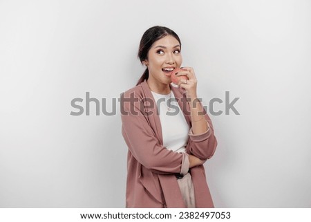 Hungry Asian woman employee is happy about snacking apple, mouth bite healthy food for diet and organic lifestyle, isolated by white background Royalty-Free Stock Photo #2382497053