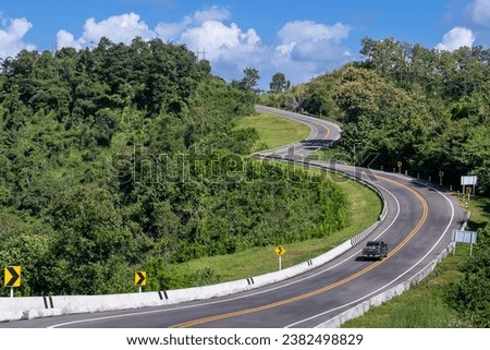 The road is similar to the number 3, This road is built on a mountain, past the forest in Nan Province of Thailand. The zigzag road number 3. Good scenery, famous, and have tourists to take pictures.