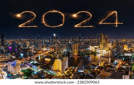 2024 happy new year fireworks celebrating over Chao Phraya river in Bangkok city at the night, Thailand