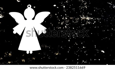 one wooden angel on a dark background with white specks and with copy space