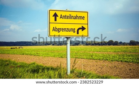 An image with a signpost pointing in two different directions in German. One direction points towards participation, the other points towards differentiation. Royalty-Free Stock Photo #2382523229