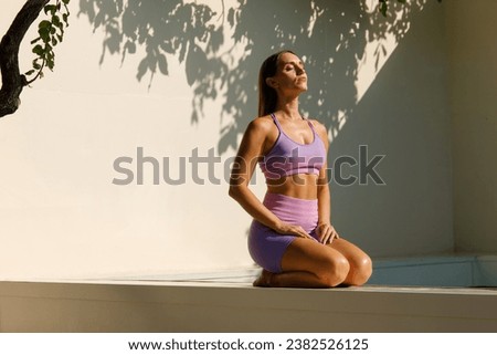 Serenity in Motion: Yoga by the Pool Royalty-Free Stock Photo #2382526125