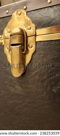 Antique chest golden old Iron hasps and trunk latch Royalty-Free Stock Photo #2382530395