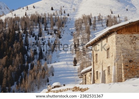 Rural building near a ski slope in the Italian Alps