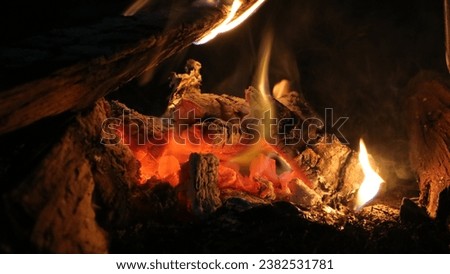 Smoldering Firewood in The Campsite