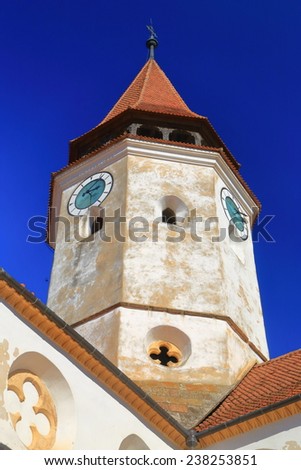 Upper tower of a church in medieval town in Prejmer, Transylvania, Romania