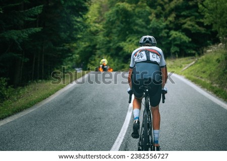 Summer Cycling in the French Countryside: A Snapshot of a Pro Cyclist's Journey. Scenic Sports Photography with a Blur-Enhanced Twist