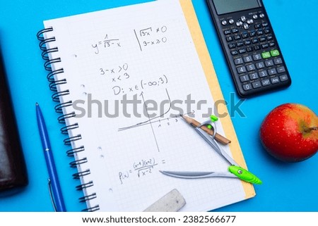 Flat lay photo showing function calculation. Solving math problems and studying for the exam