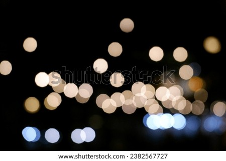 4:3 Warm white, gold and silver blurred bokeh lights on black background. abstract blurred light element that can be used for cover decoration overlay background. defocused circle round lightbulbs.