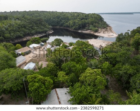 Beautiful aerial view to Santo Antônio riverside community in green amazon rainforest, RDS Rio Negro, Amazonas, Brazil