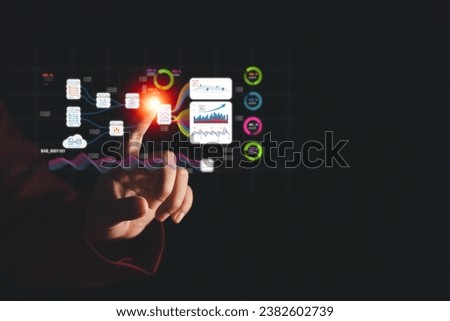 Witness a businessman's journey into the world of data analysis with our image featuring AI technology and virtual screens. Explore the realm of data processing, collection, and analysis Royalty-Free Stock Photo #2382602739