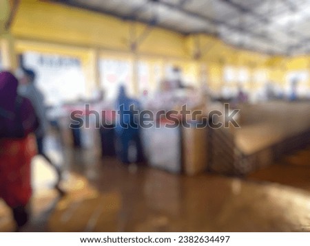 Traditional indoor fresh market in Indonesia, image blurred Bokeh Vintage tone effect background.