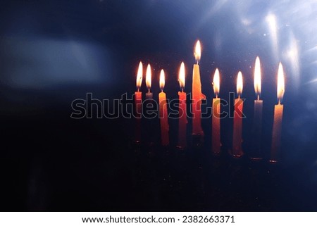 Religion image of jewish holiday Hanukkah background with menorah (traditional candelabra) and candles