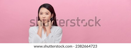 Face of serious young woman with natural make-up looking at camera Royalty-Free Stock Photo #2382664723