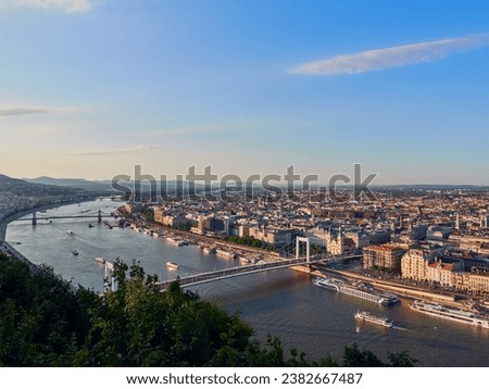 A panoramic view from Citadella to Pest side of Budapest. From forefront to background: Elisabeth bridge (Erzsébet híd), Chain bridge (Széchenyi Lánchíd) and Margaret Bridge (Margit híd). Royalty-Free Stock Photo #2382667487
