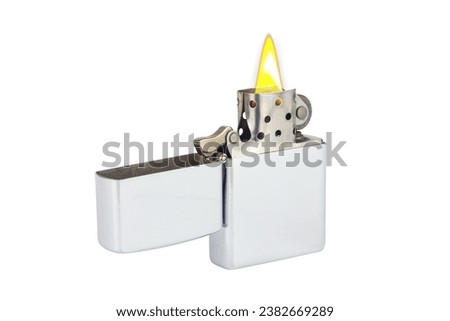 Metal lighter, petrol lighter isolated from background Royalty-Free Stock Photo #2382669289