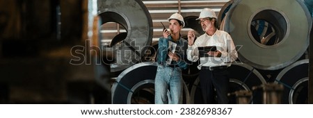 Metalwork manufacturing factory manager inspect newly manufactured metal or steel roll and frame in factory. Inspection and quality control process for highest quality product. Panorama Exemplifying Royalty-Free Stock Photo #2382698367