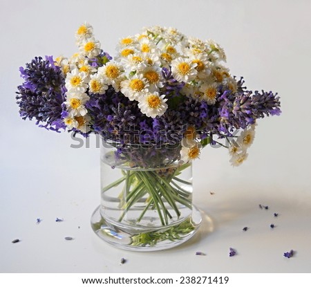 Bouquet of mini chrysanthemum flowers and lavender in a vase. Floral decoration.