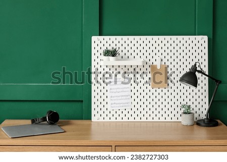 Musician's workplace with pegboard in office