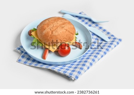 Plate with funny children's breakfast in shape of turtle isolated on white background