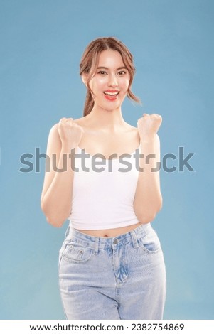 Young Asian beauty woman pull back hair with Koreans makeup style on face and perfect clean skin cheerful cheery, glad on isolated blue background. Royalty-Free Stock Photo #2382754869