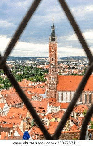 Panoramic view of Landshut from Trausnitz castle. Old town and cathedrals, architecture, roofs of houses, streets landscape, Landshut, Germany. vertical photo
