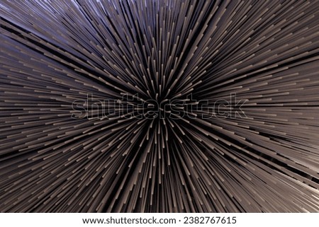 A black and purple starburst pattern with a center point and radiating lines. A modern and futuristic abstract background with geometric lines and cosmic elements
