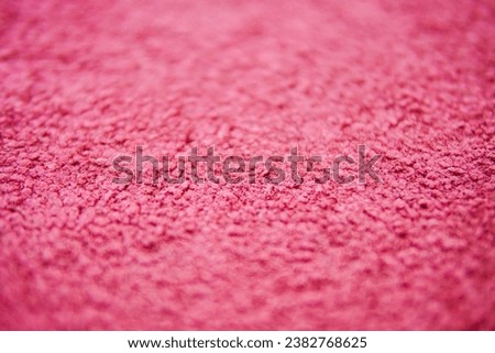 Red carpet texture with soft smooth seamless patterns on floor. selective focus