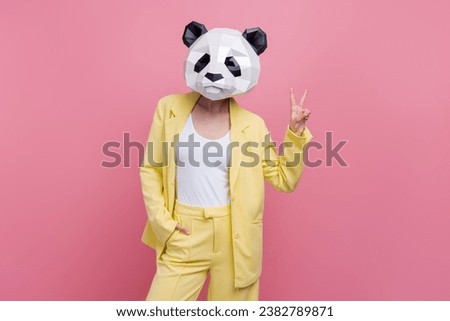 Portrait of funky elegant person 3d panda head mask put hand pocket demonstrate v-sign isolated on pink color background