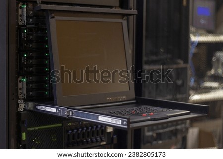 Data Center Server station with an open KVM Royalty-Free Stock Photo #2382805173