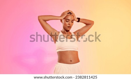 Tired slim sweat young latin woman athlete in sportswear hold head with hands, suffer from headache on neon pink studio background. Break from sports, problems with body care, bad feeling