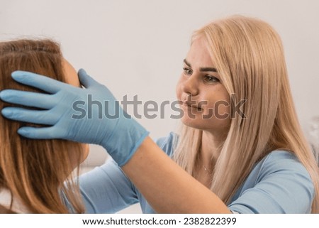 Instant harmony: The photo captures an important moment of a woman's meeting with a professional cosmetologist in a beauty salon. Individual approach: The client talks to a cosmetologist in a spa Royalty-Free Stock Photo #2382822399