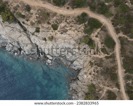 Sea landscape with Cap de Creus, natural park. Eastern point of Spain, Girona province, Catalonia. Famous tourist destination in Costa Brava. Sunny summer day with blue sky and clouds. Aerial view