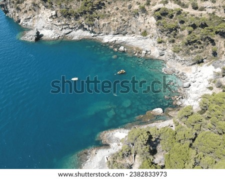 Sea landscape with Cap de Creus, natural park. Eastern point of Spain, Girona province, Catalonia. Famous tourist destination in Costa Brava. Sunny summer day with blue sky and clouds. Aerial view