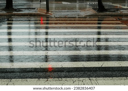 Pedestrian crossing wet from rain