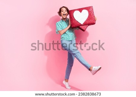Full size portrait of overjoyed impressed girl arms hold large like notification icon collage isolated on pink color background