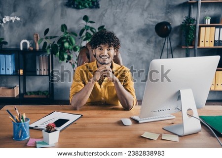 Photo of successful nice man hacker dressed stylish clothes sitting in his workspace modern office indoors