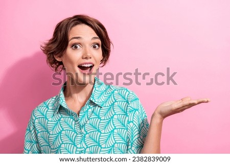 Photo of nice impressed lady open mouth hand hold empty space offer isolated on pink color background