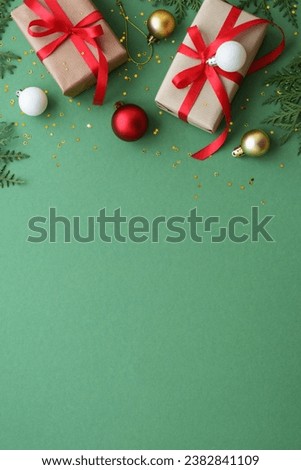 Christmas Present and red decorations at color background.