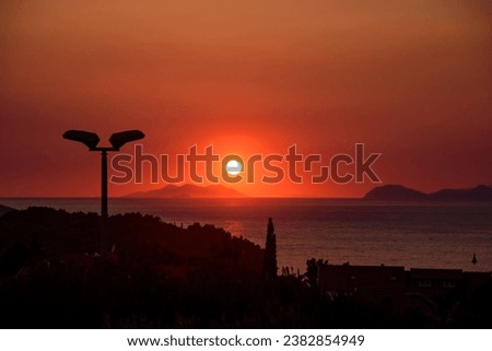 Sunset into the sea in Cavtat, Croatia