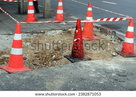 A lot of traffic cones protect beside a street in the constructions site. Royalty-Free Stock Photo #2382871053