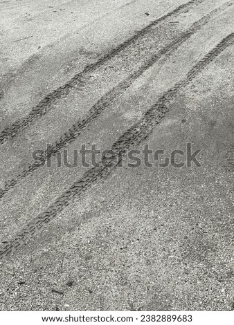 tire tracks on the road.