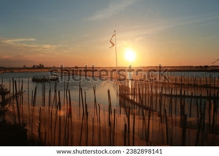 Beautiful sunset in "Tam Giang" Lagoon A Beautiful and Famous Lagoon in Hue City, Viet Nam for Eco nature travel. And Hue city is worldwide famous for wonderful natural landscapes, unique festivals. Royalty-Free Stock Photo #2382898141