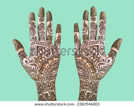 Mehndi artist making mehndi bridal hand In India, mehndi design. Mehendi design for Karva Chauth