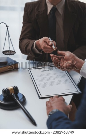 Lawyer, legal advisor, Asian male businessman explaining details of business contract agreement with investor Hand in the pen to sign contract documents, financial investment legal concepts.